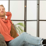 Smiling man sitting with radon health question headline